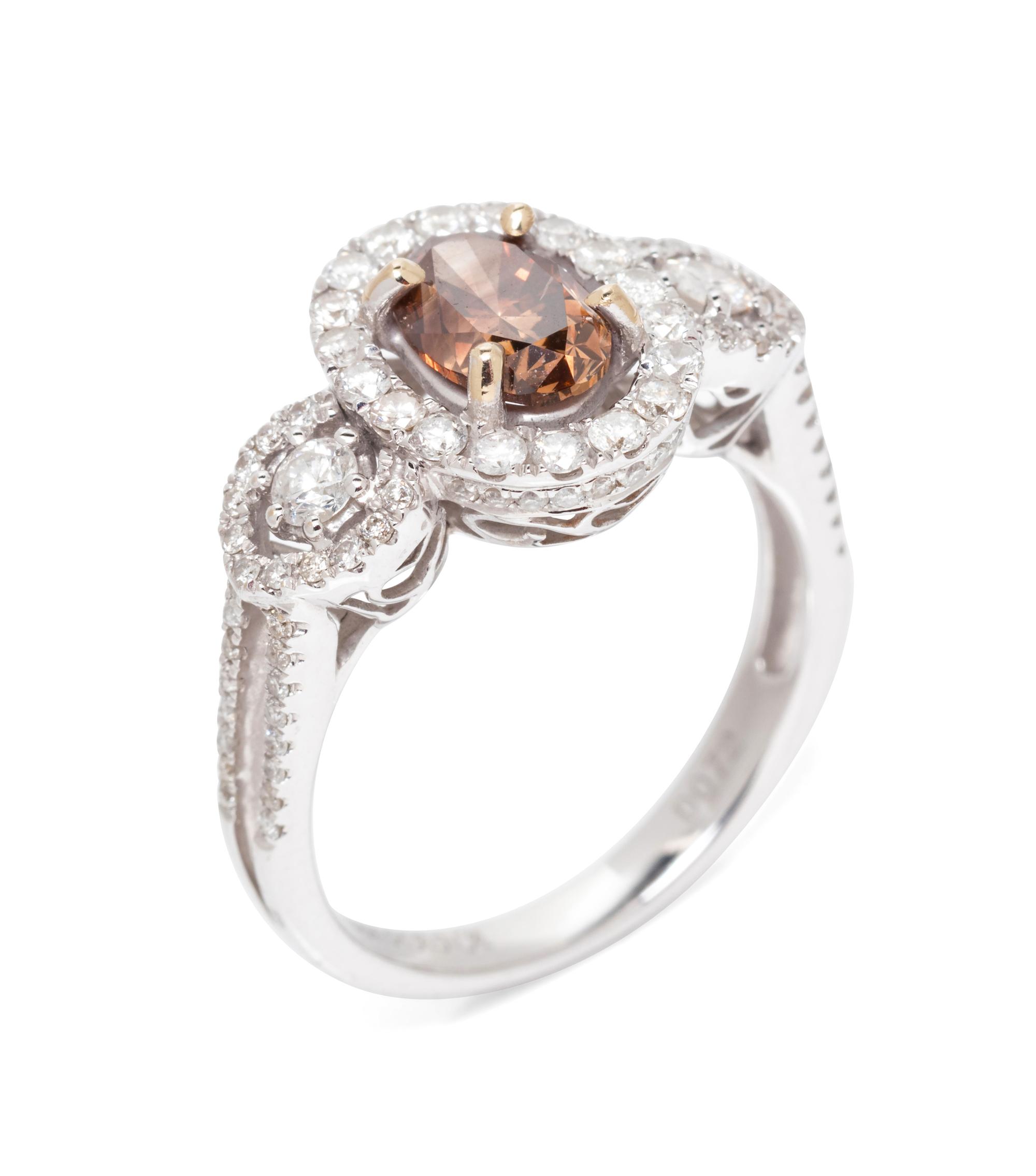 An 18 Karat White Gold, Colored Diamond and Diamond Ring,
