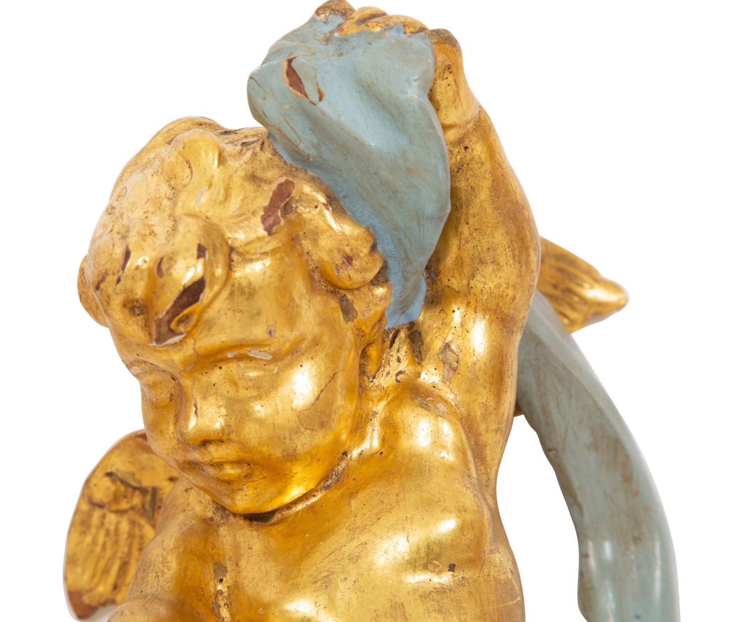 A Pair of Italian Giltwood and Painted Putto-Form Wall Sconces