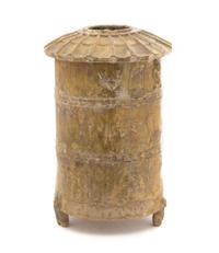 A Chinese Brown Glazed Pottery Granary Height 13 1/2 inches. — HAN DYNASTY (206 B.C. - A.D. 220)