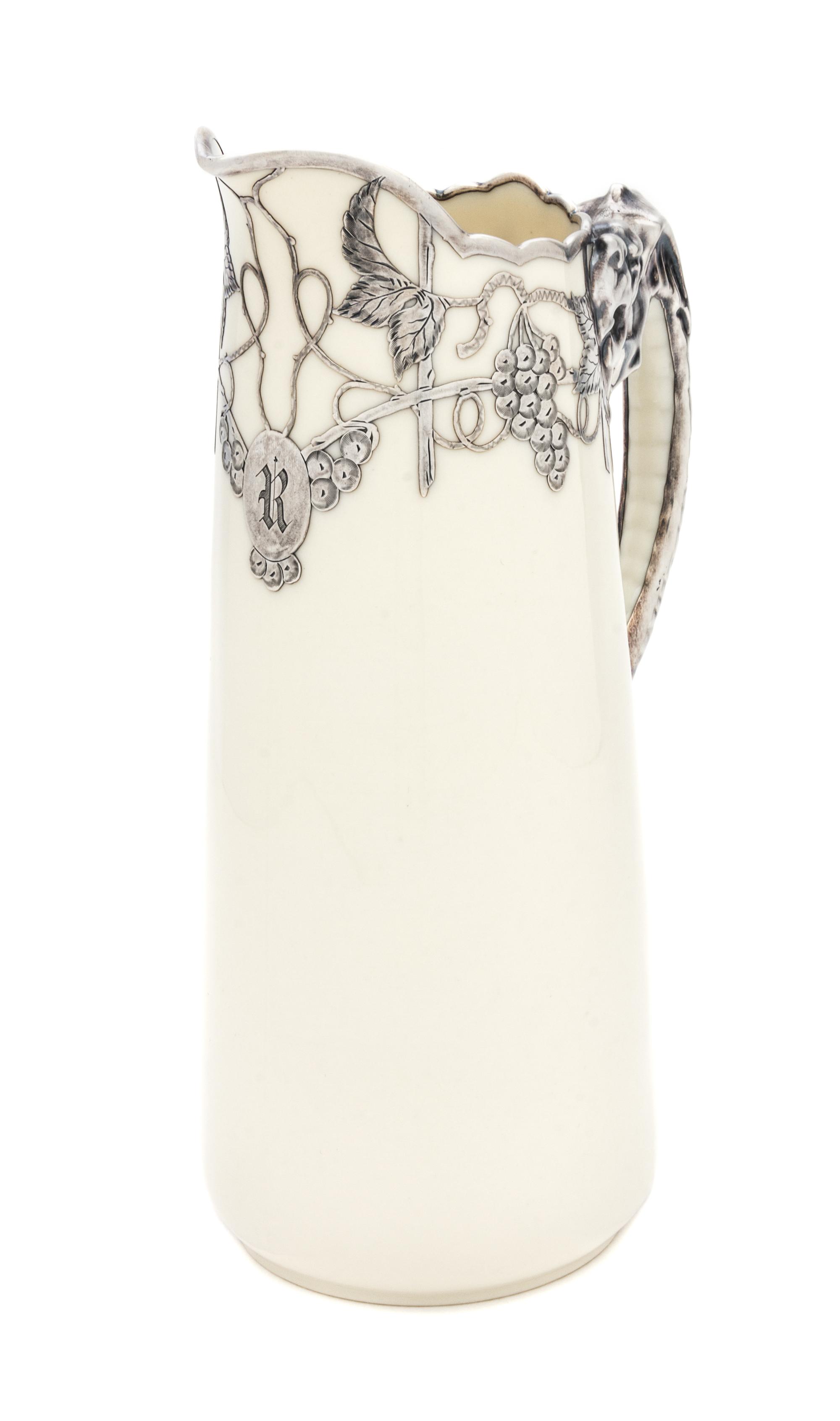 A Belleek Willets Silver Overlay Ewer Height 9 1/2 inches.