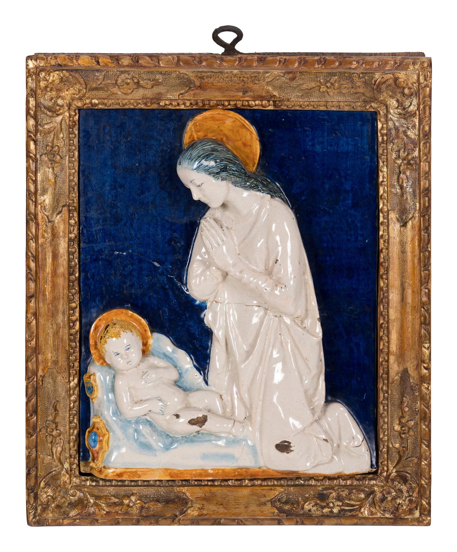 An Italian Glazed Earthenware Plaque of the Madonna and Child