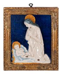 An Italian Glazed Earthenware Plaque of the Madonna and Child