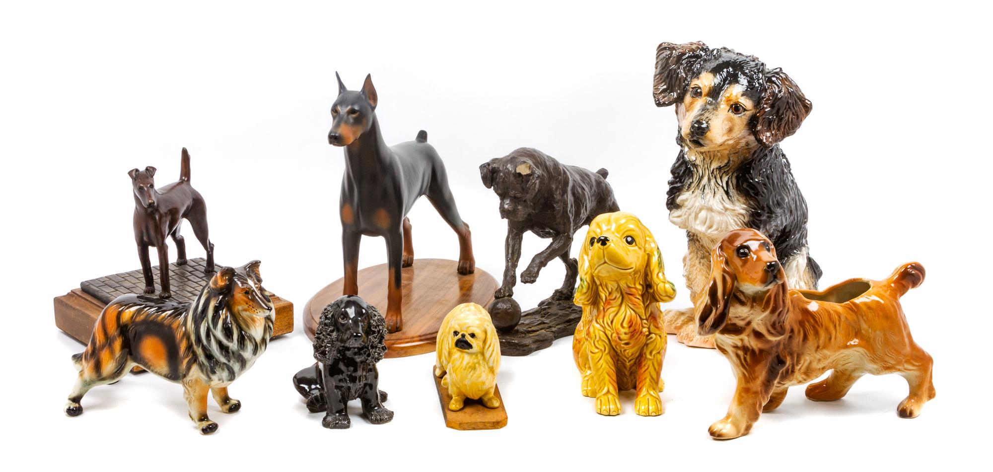 A Group of Nine Dog Figures of Various Breed Height of tallest 13 1/2 inches.