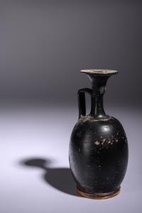 A Greek Black Glazed Lekythos