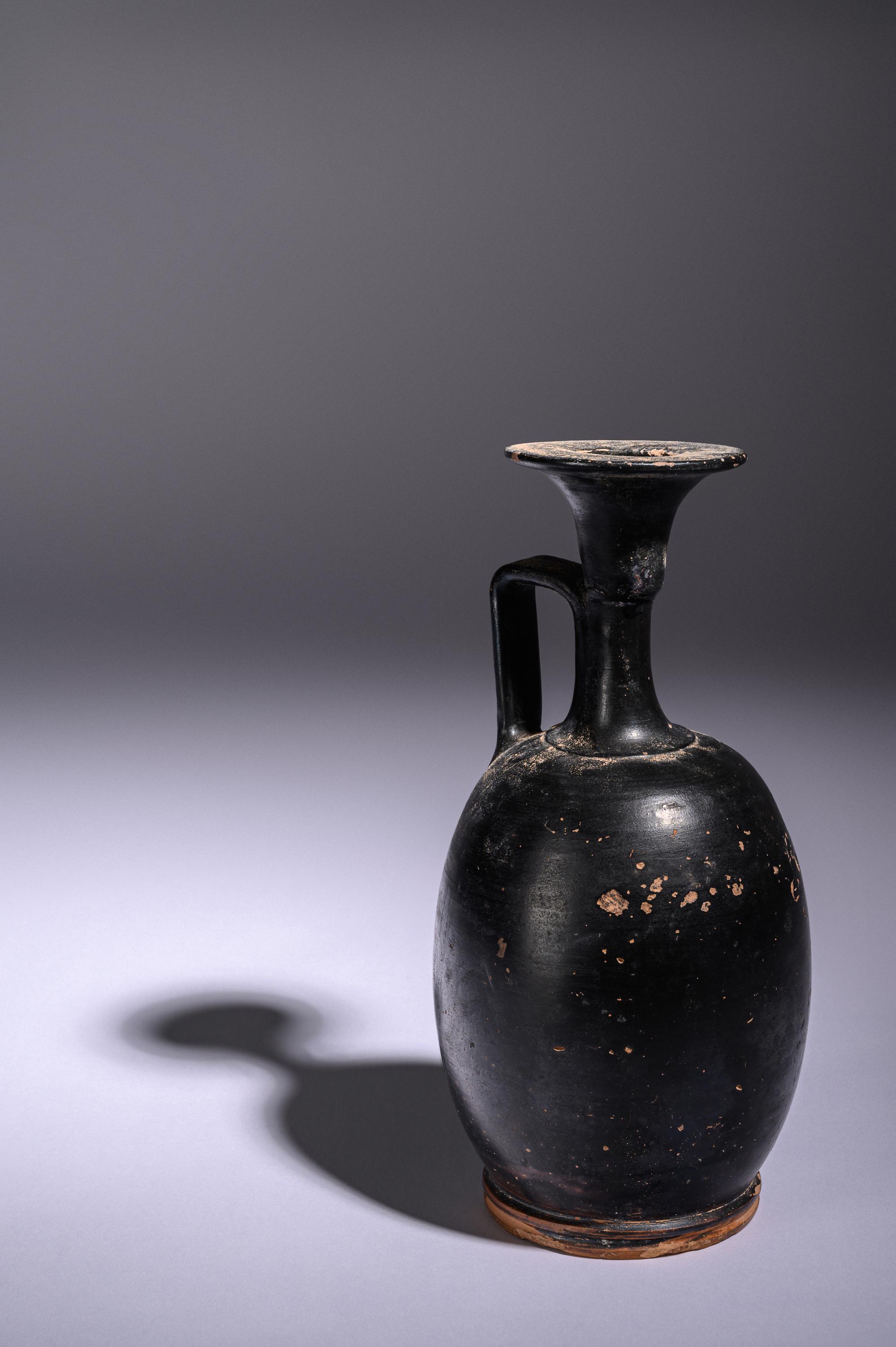 A Greek Black Glazed Lekythos