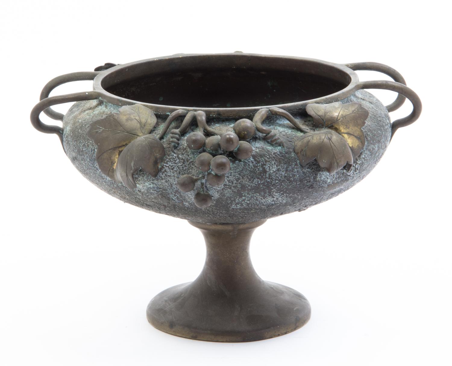 A Japanese Patinated Bronze Jardiniere Height 7 3/4 x width over handles 11 3/4 inches.