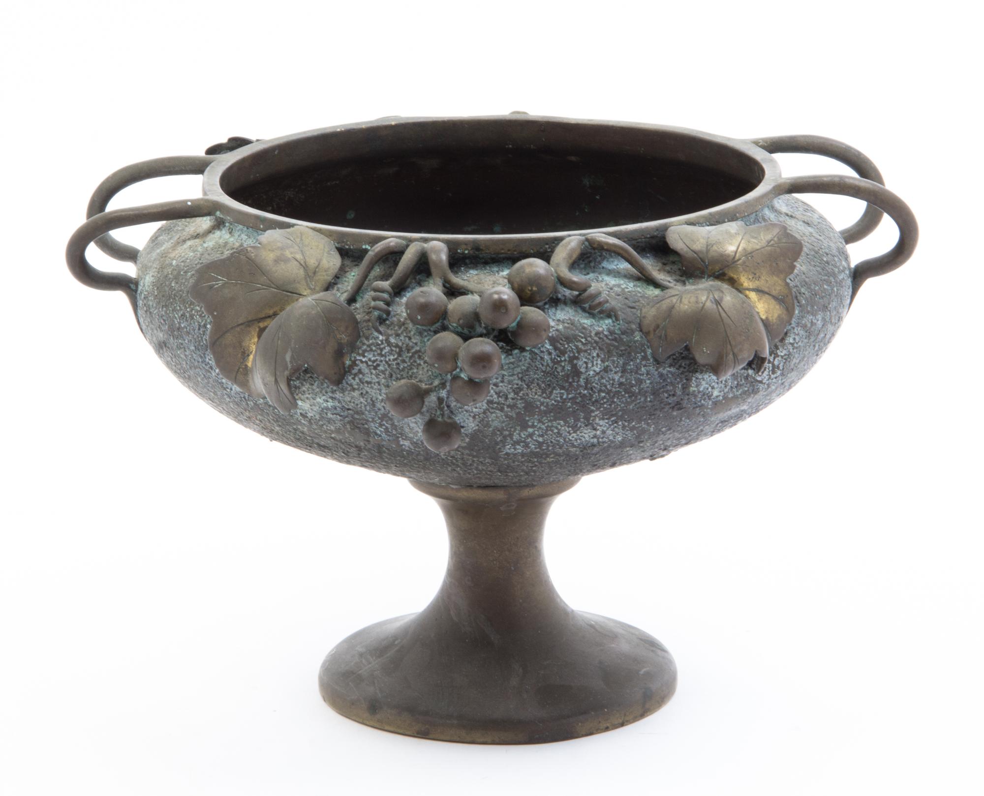 A Japanese Patinated Bronze Jardiniere Height 7 3/4 x width over handles 11 3/4 inches.
