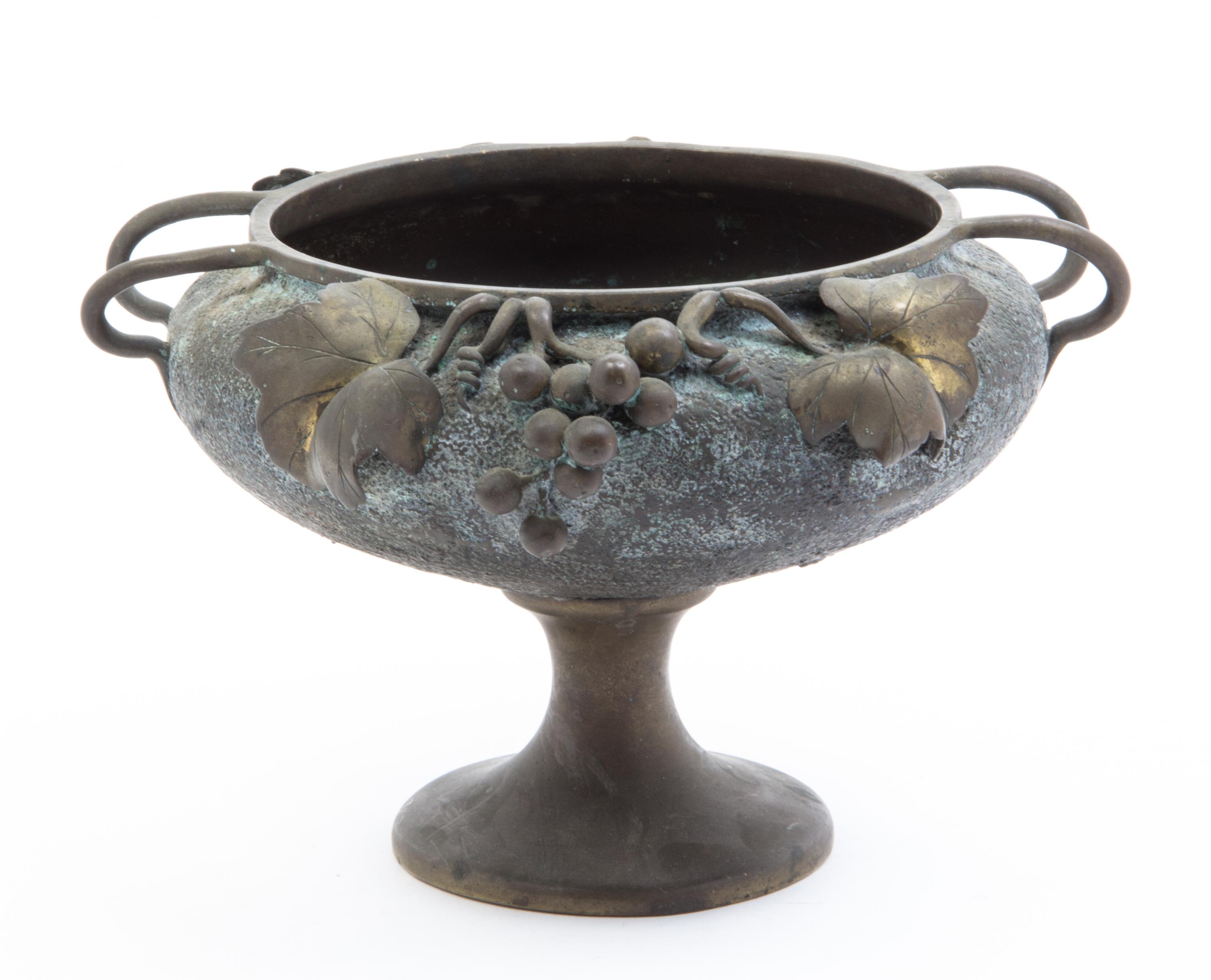 A Japanese Patinated Bronze Jardiniere Height 7 3/4 x width over handles 11 3/4 inches.