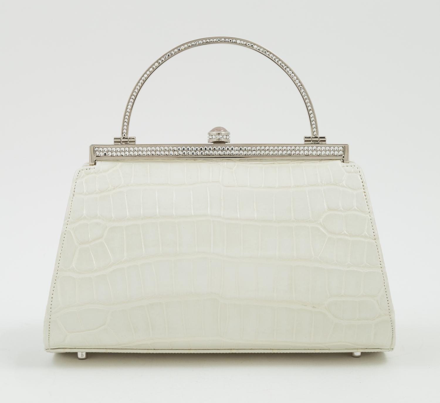 A Judith Leiber Cream Crocodile Handbag, 6.5" x 5" x 4".