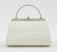 A Judith Leiber Cream Crocodile Handbag, 6.5" x 5" x 4".