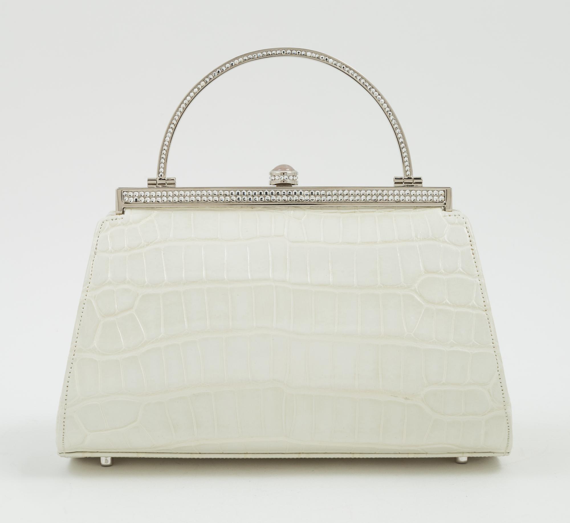 A Judith Leiber Cream Crocodile Handbag, 6.5" x 5" x 4".