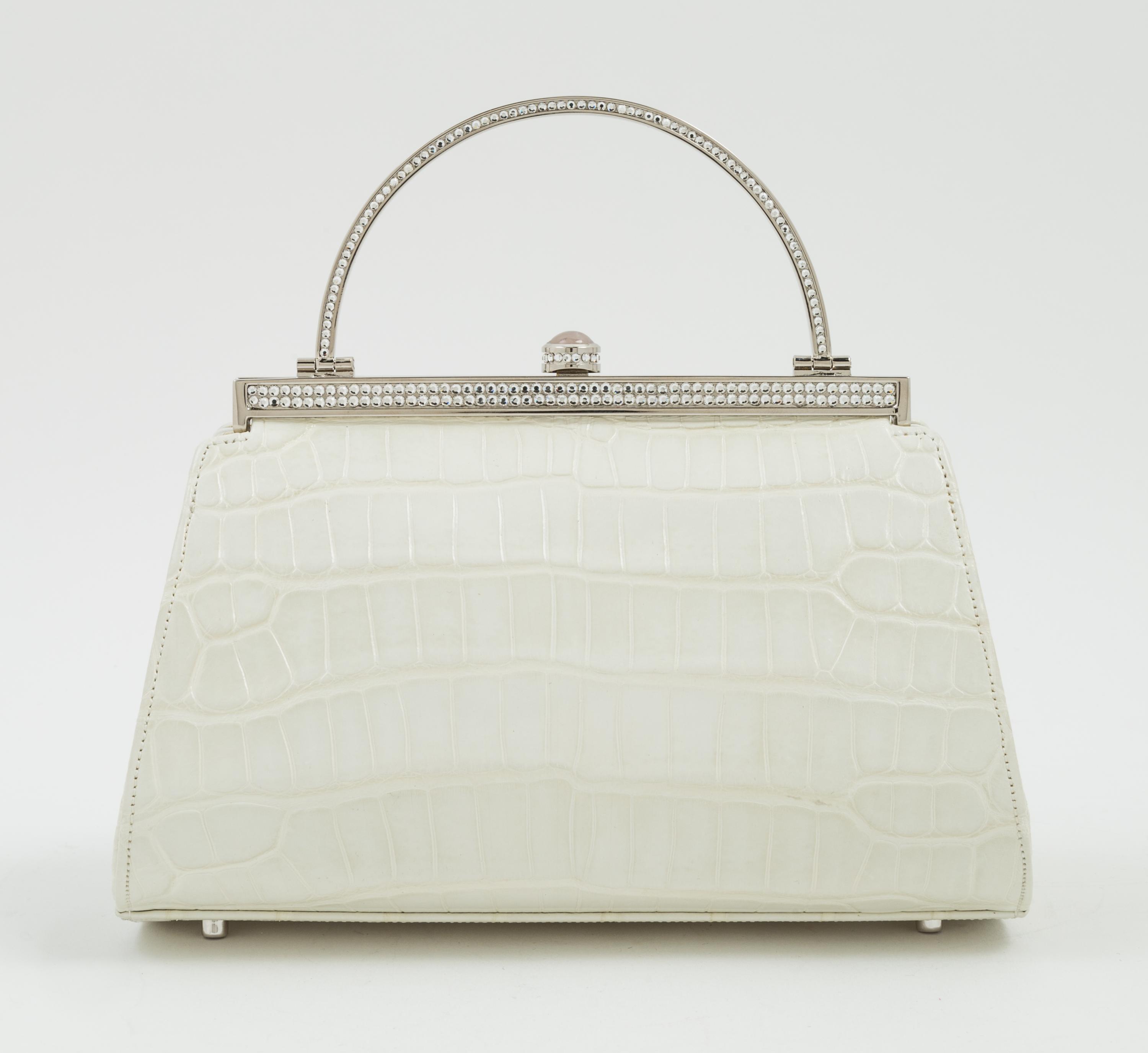 A Judith Leiber Cream Crocodile Handbag, 6.5" x 5" x 4".