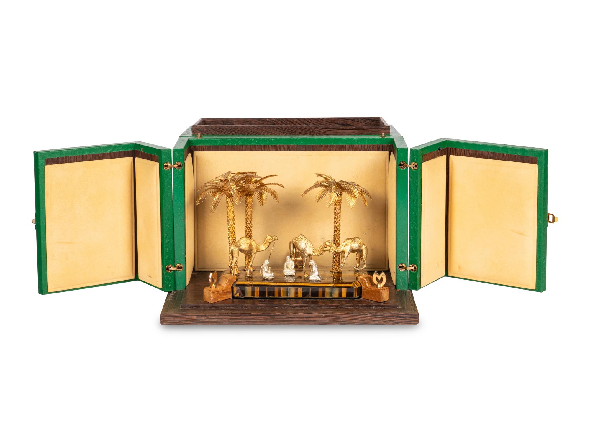 A Mouawad Silver-Gilt and Tiger's Eye Figural Group