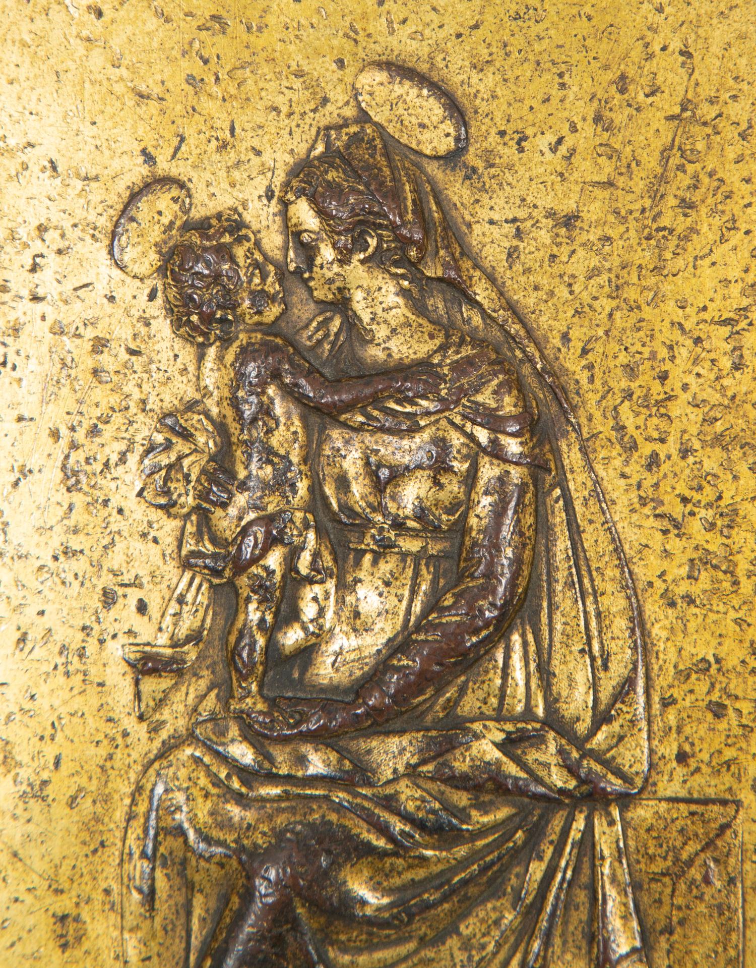 An Italian Gilt Bronze Plaquette Depicting the Virgin Mary and Child