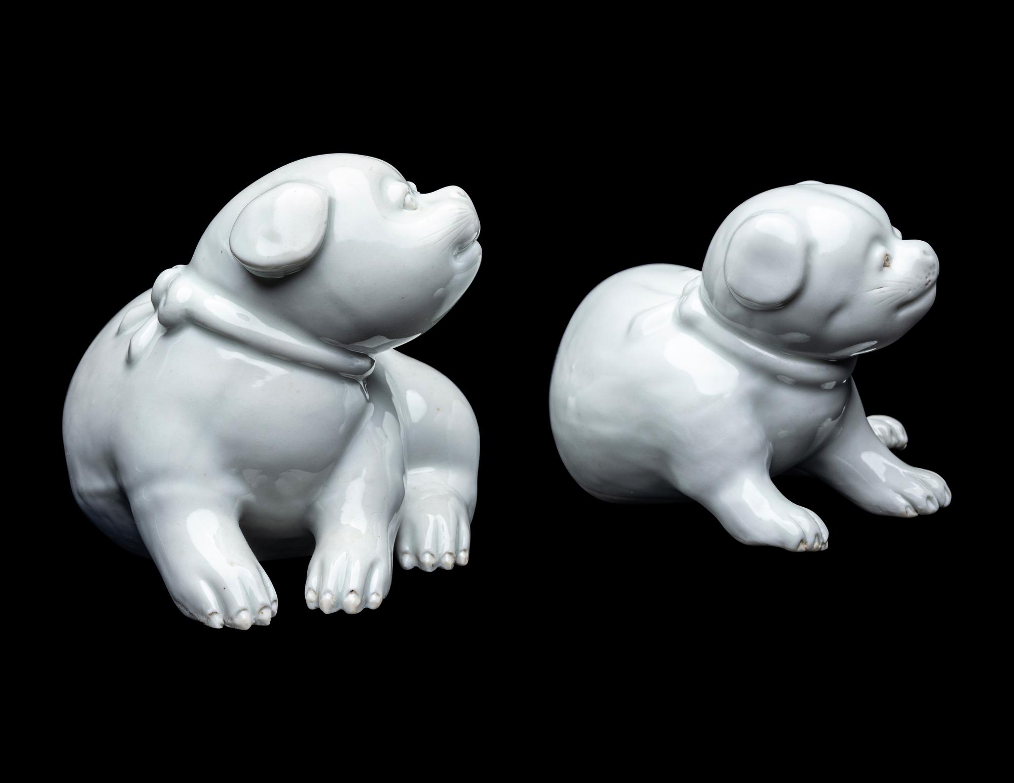 A Pair of Japanese Hirado White Glazed Porcelain Figures of Puppies