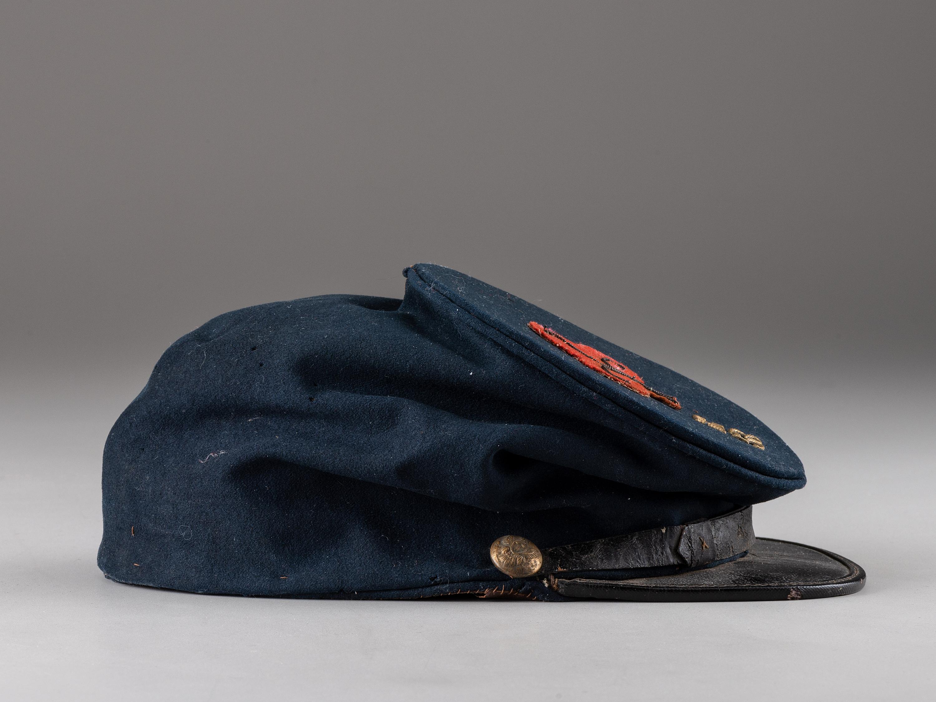 [CIVIL WAR]. 53rd Pennsylvania forage cap with insignia and II Corps, 1st Division badge.