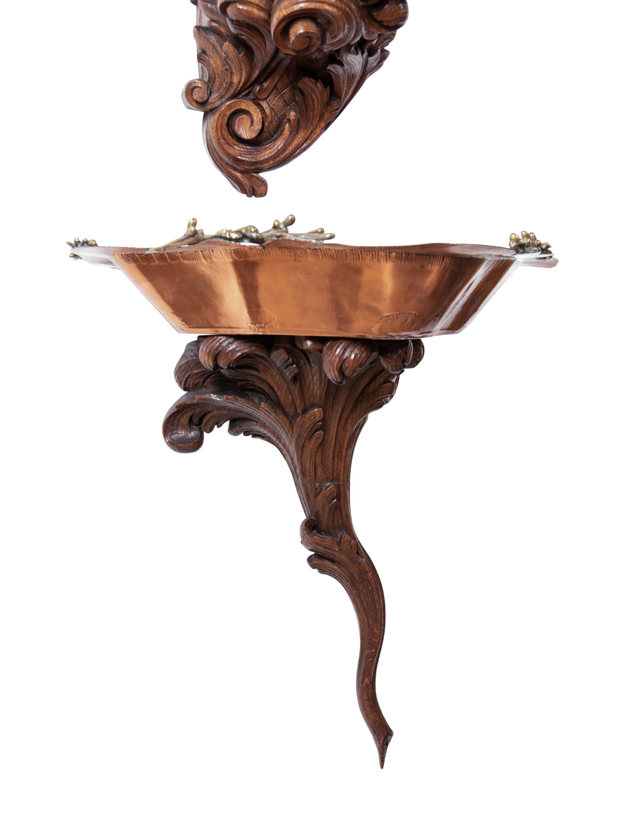 A French Copper and Brass Lavabo and Basin Set in a Carved Oak Bracket