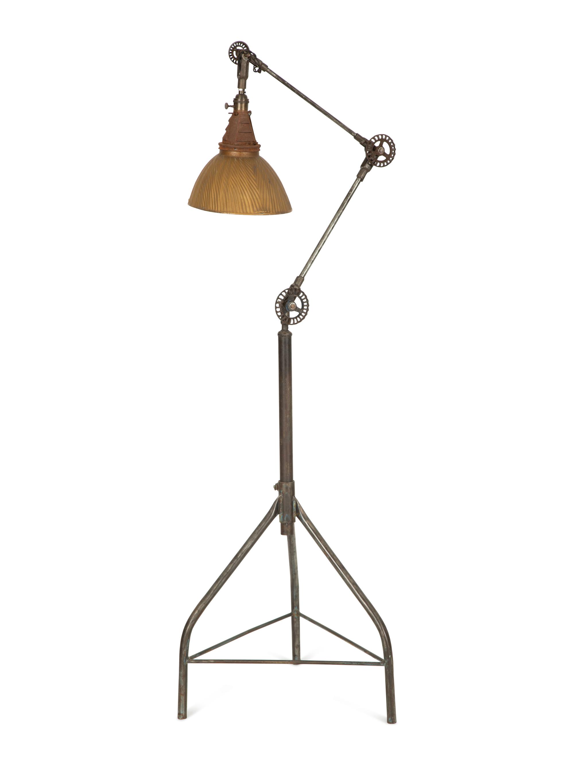 A Steel Tripod Base Articulated Floor Lamp
