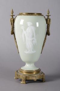 A Continental Gilt Bronze Mounted Pate-sur-Pate Urn, Height 14 1/2 inches.