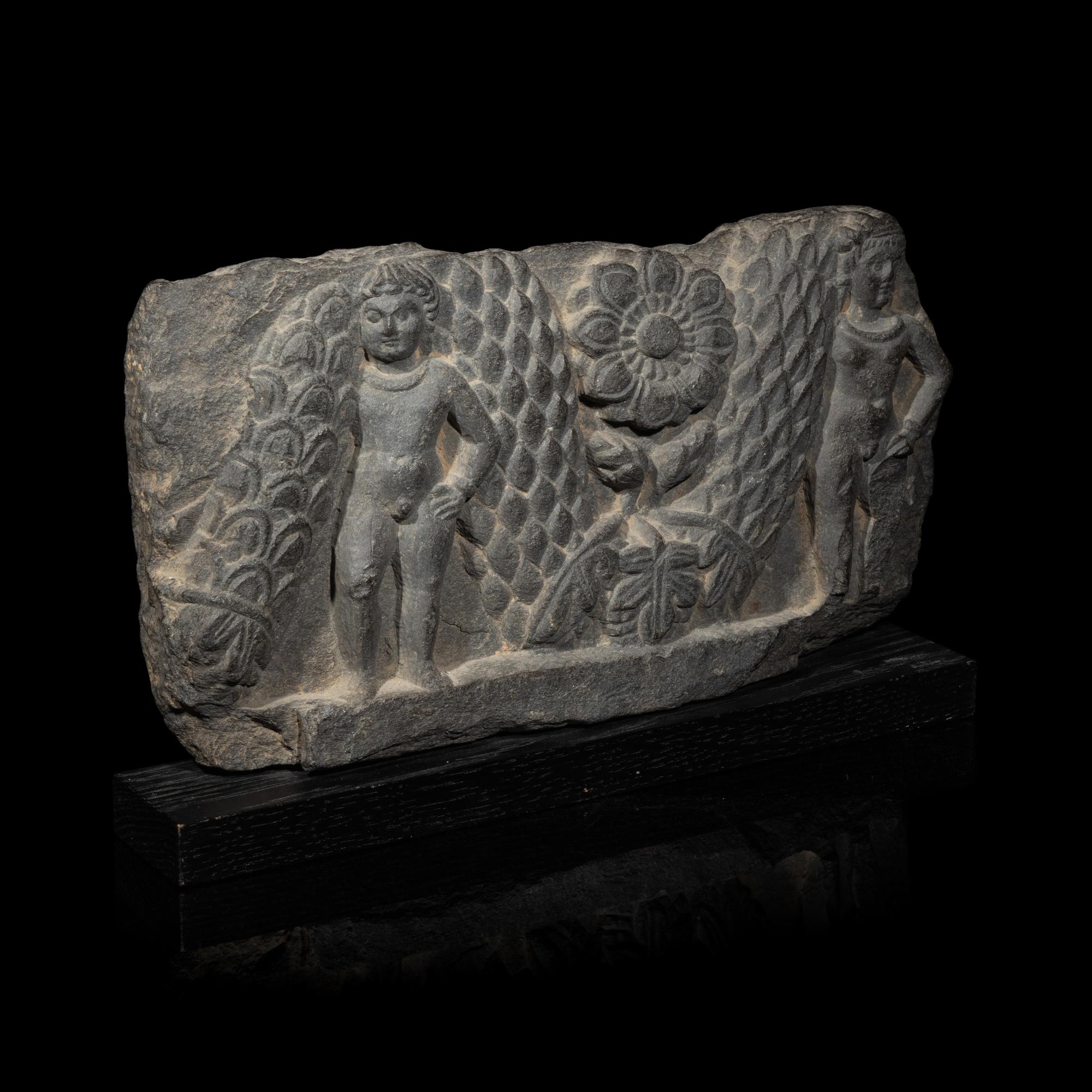 A Gandharan Grey Schist Relief of Garland Bearers, 2nd-3rd Century