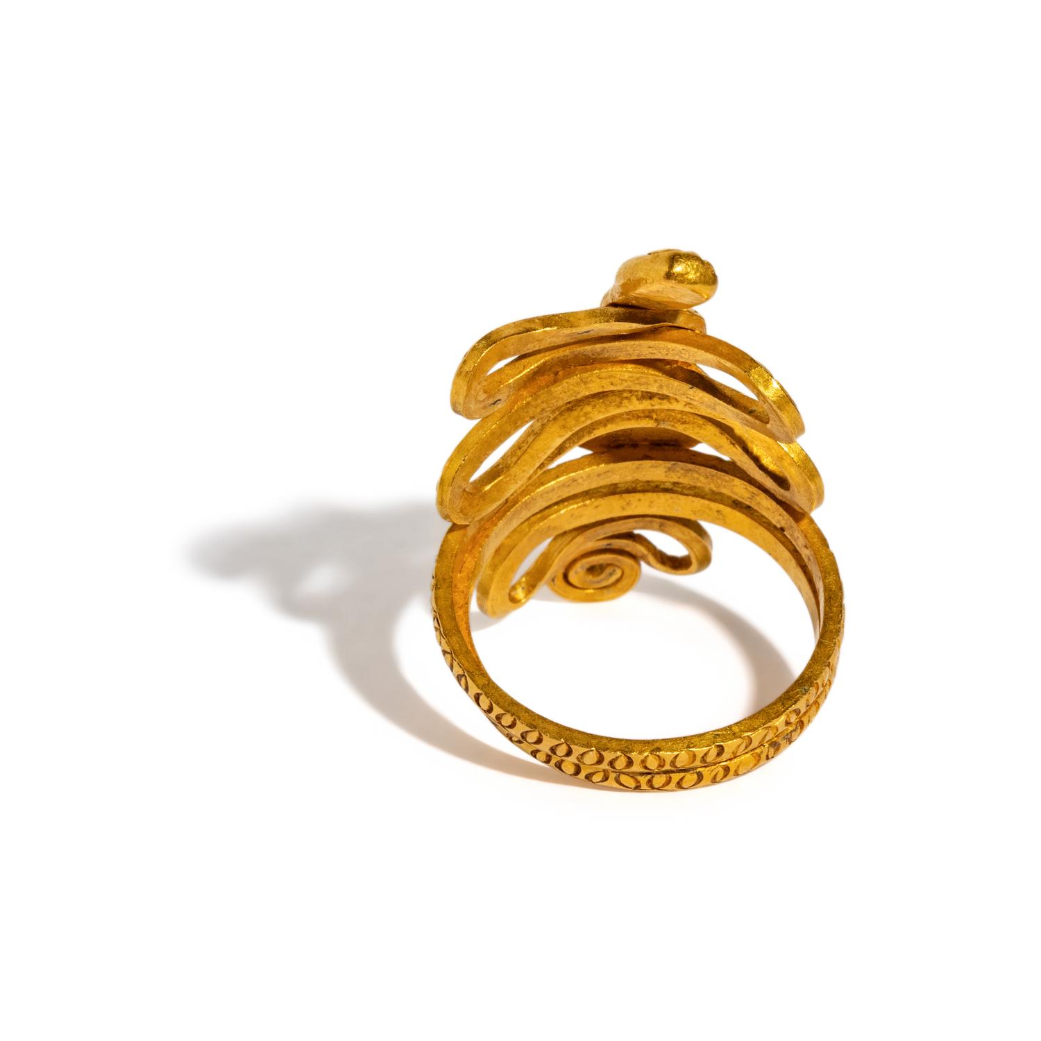 An Egyptian Gold and Garnet Snake Ring