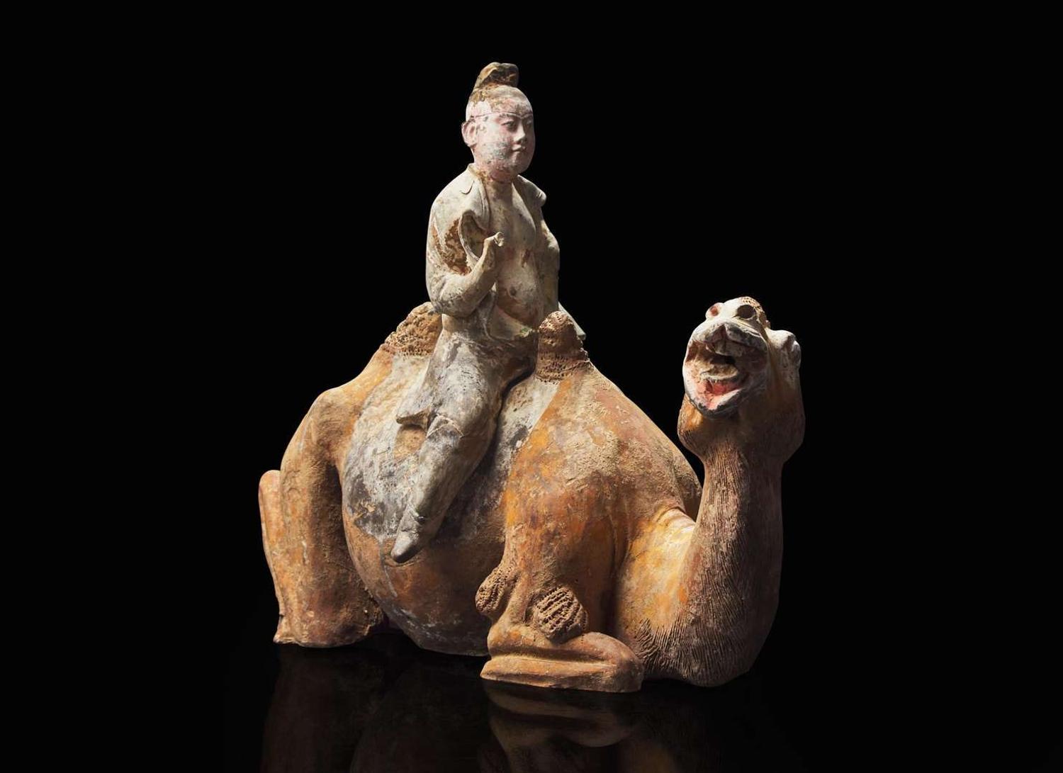 A Chinese painted pottery figure of a camel and rider, Tang dynasty 彩陶駱駝人俑 唐