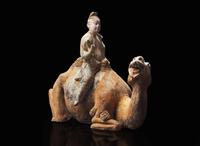A Chinese painted pottery figure of a camel and rider, Tang dynasty 彩陶駱駝人俑 唐