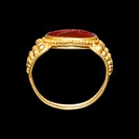 A Late Roman Gold and Carnelian Ring with an Ant Carrying an Ear of Wheat