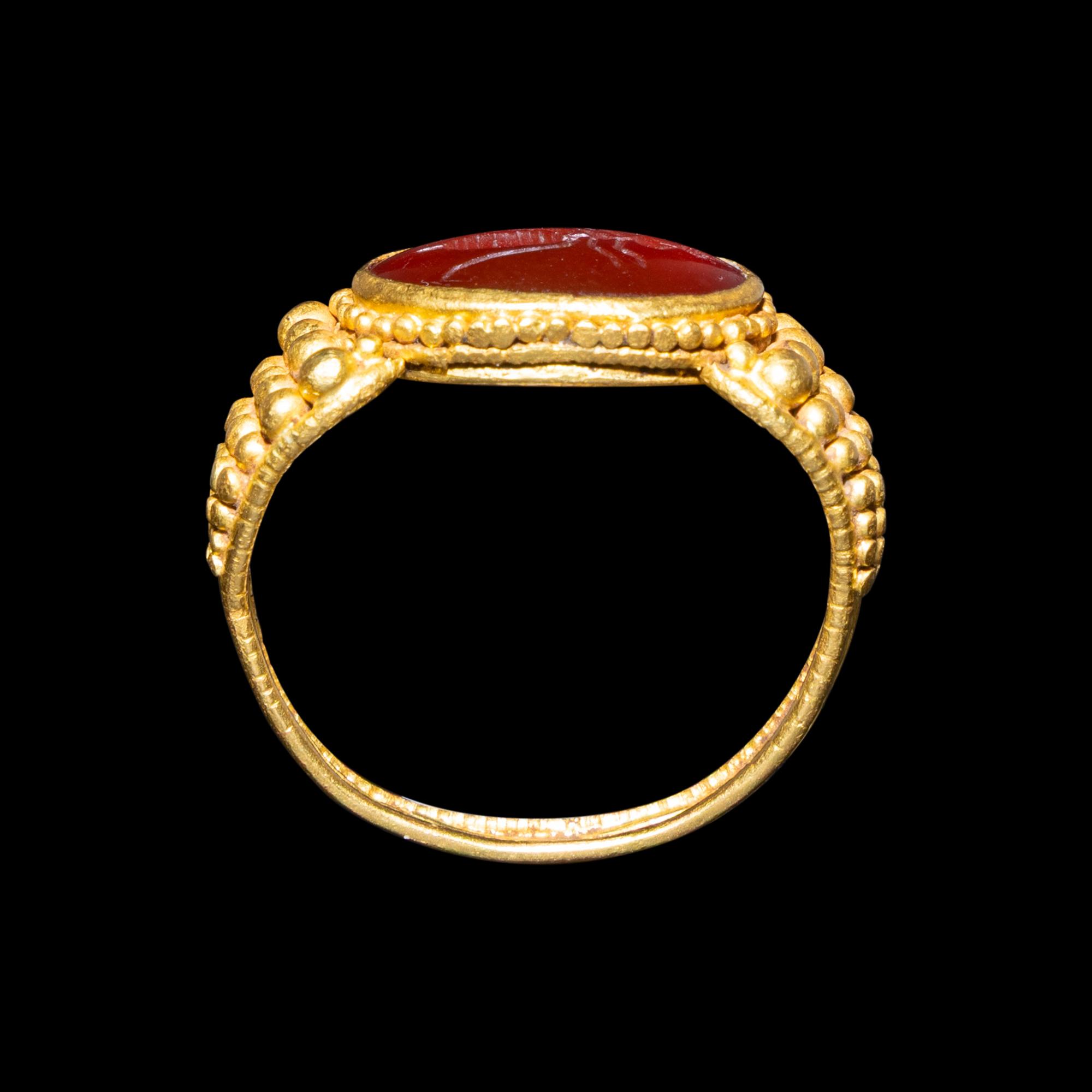 A Late Roman Gold and Carnelian Ring with an Ant Carrying an Ear of Wheat