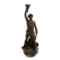 A Cast Metal Figural Newel Post Lamp