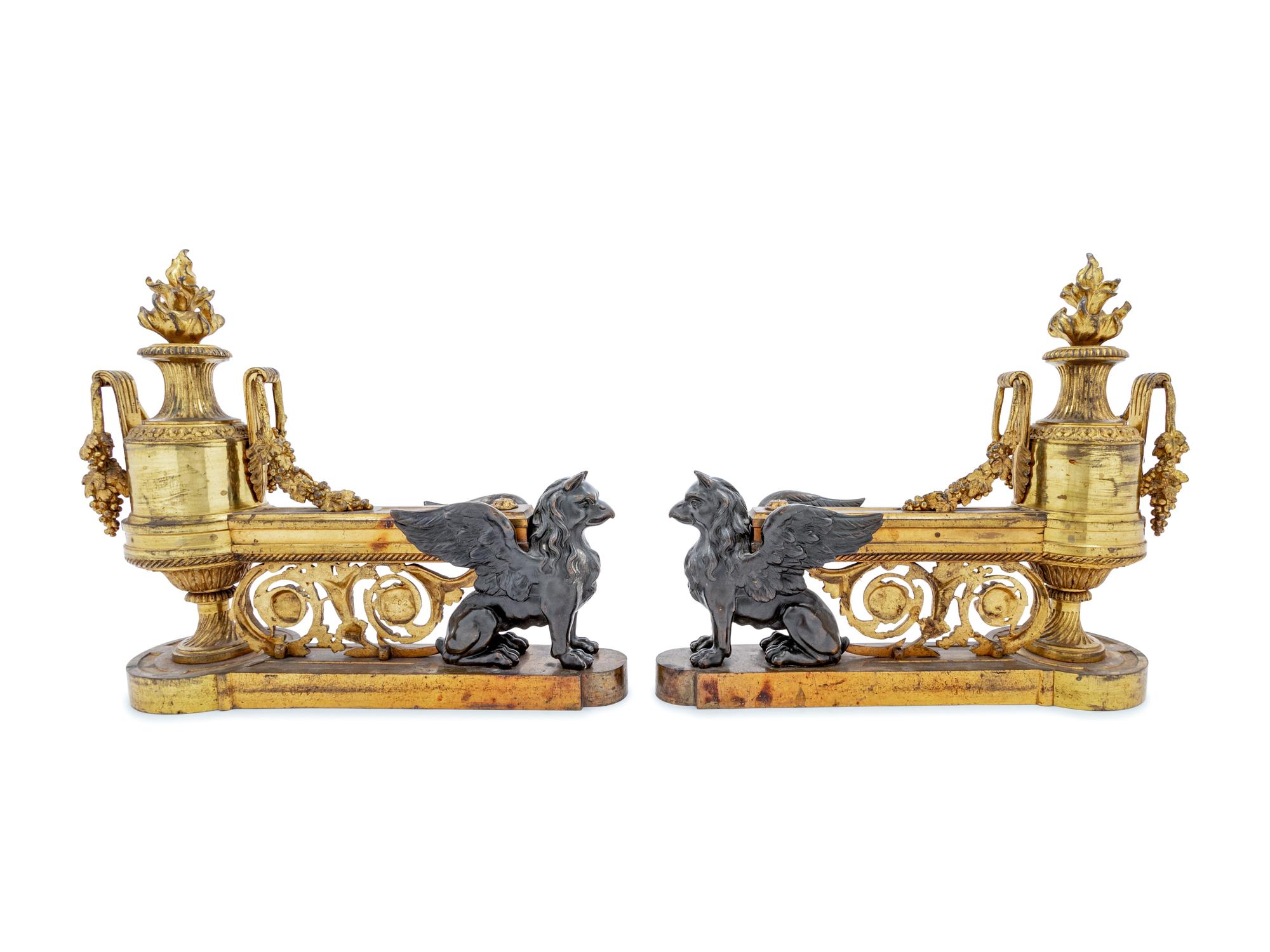 A Pair of Empire Style Gilt and Patinated Bronze Chenets
