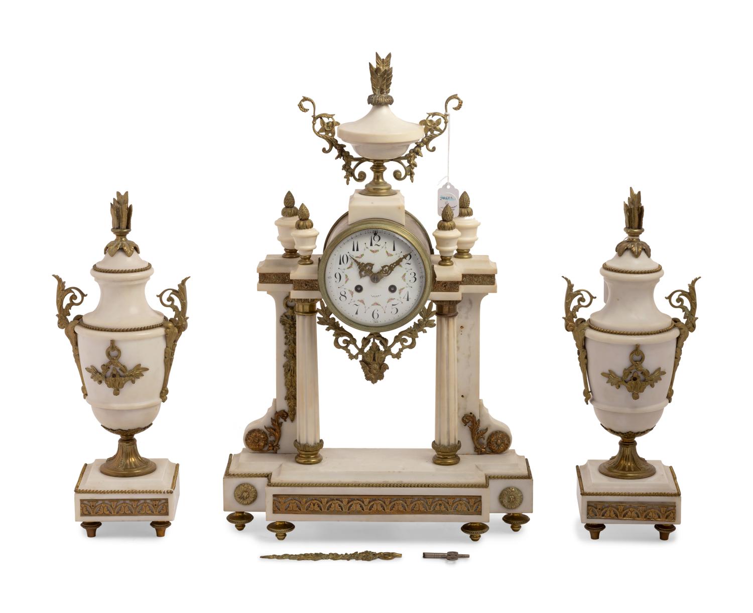 A French Gilt Metal Mounted Marble Three-Piece Clock Garniture