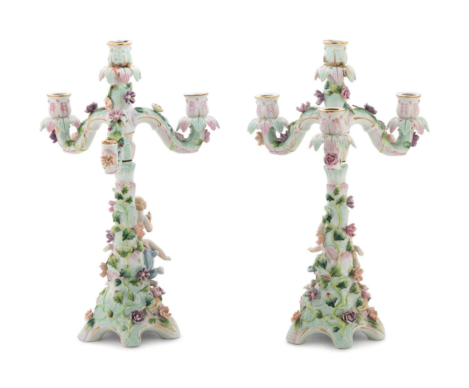 A Pair of Continental Porcelain Figural Candelabra