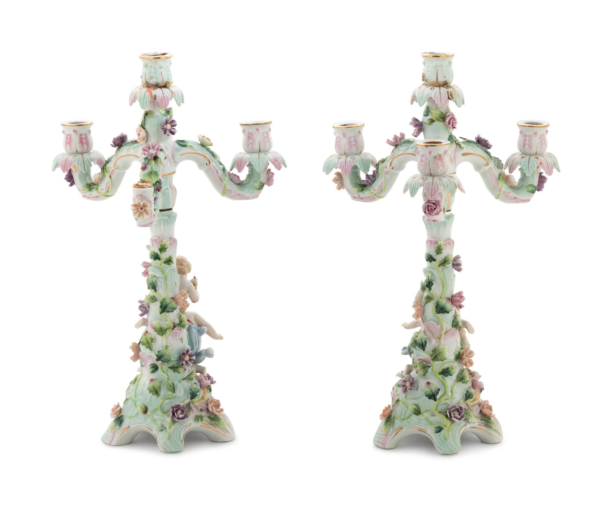 A Pair of Continental Porcelain Figural Candelabra