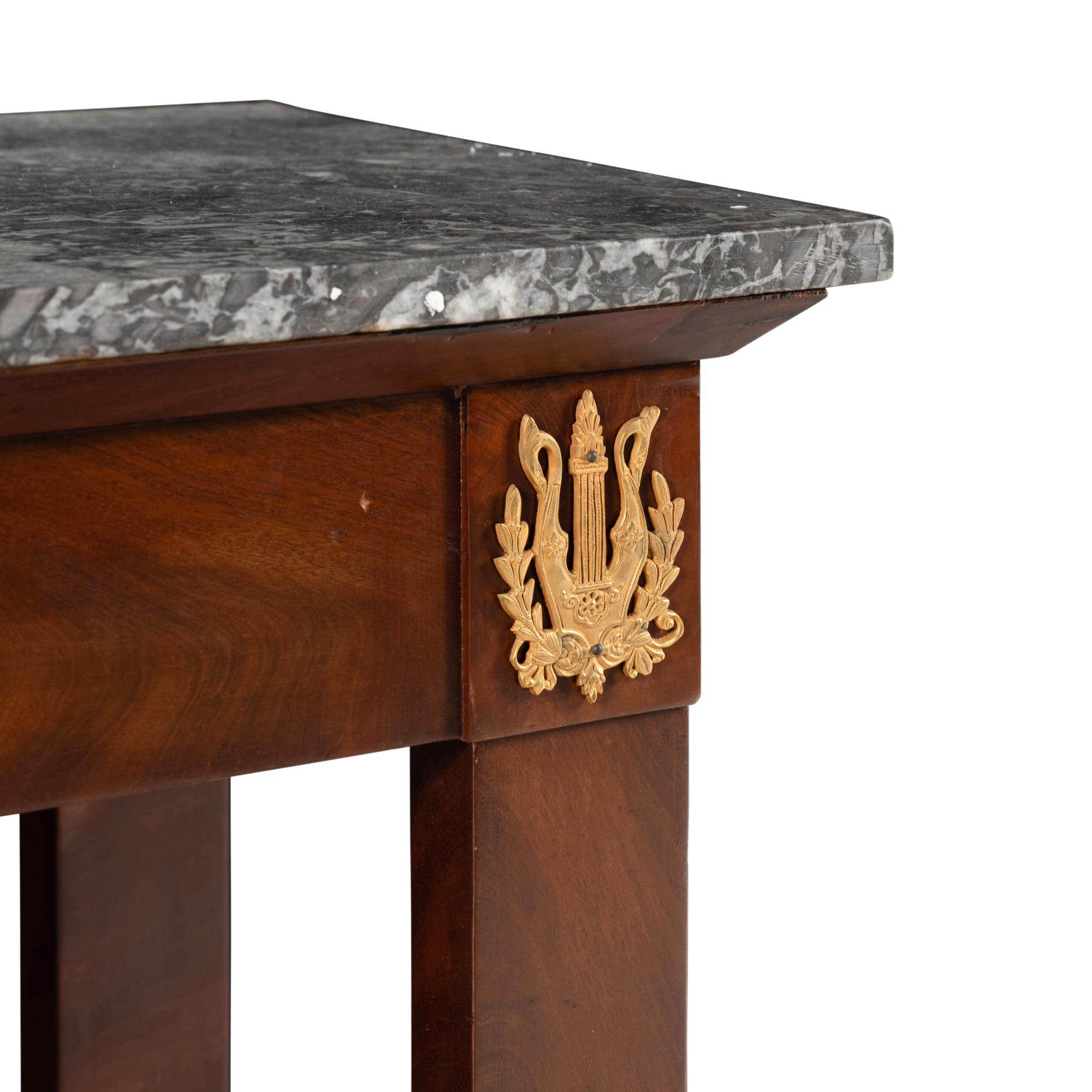 An Empire Mahogany and Gilt Metal Mounted Marble-Top Console Table