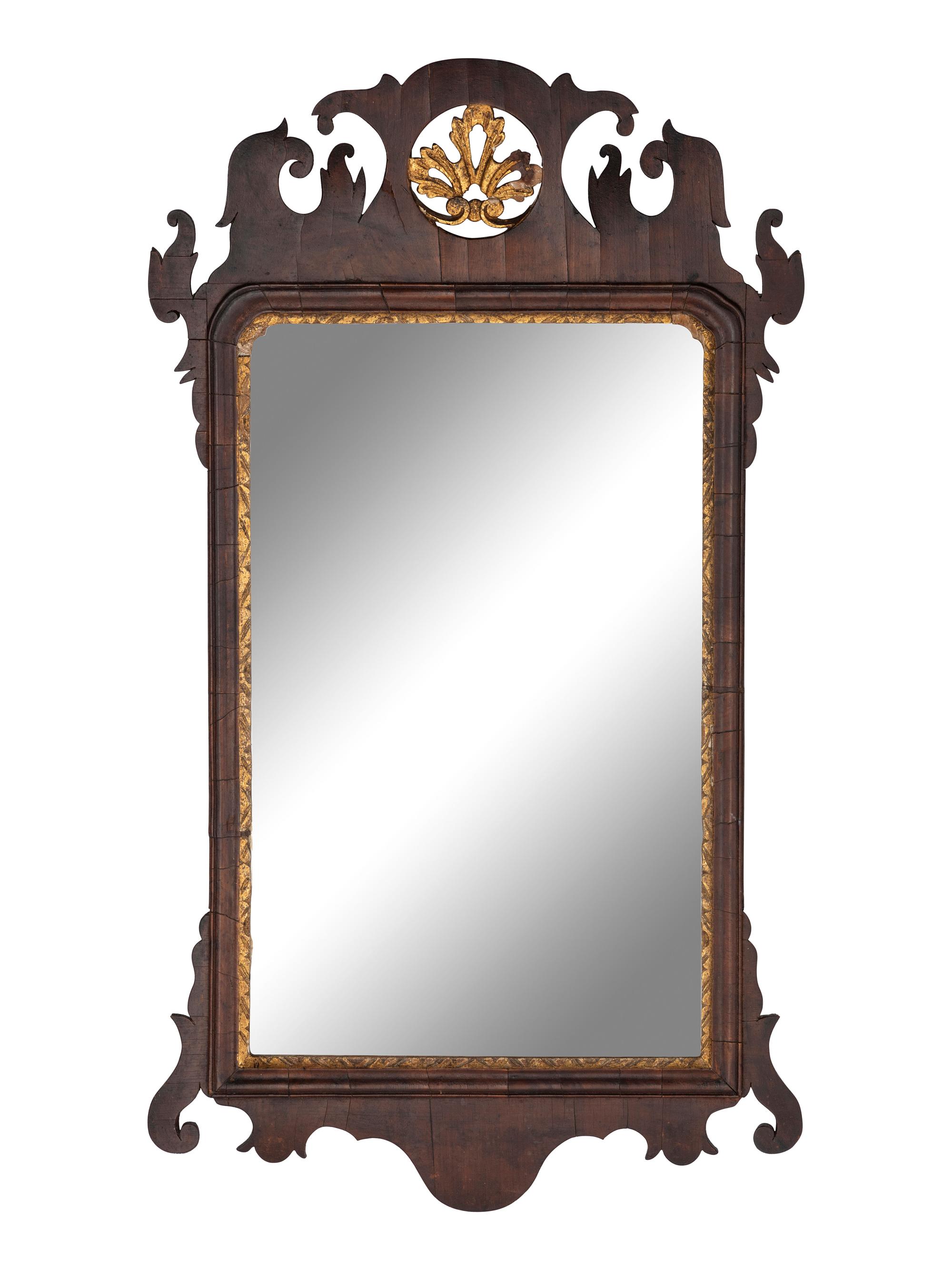 A Chippendale Carved and Parcel-Gilt Figured Mahogany Looking Glass