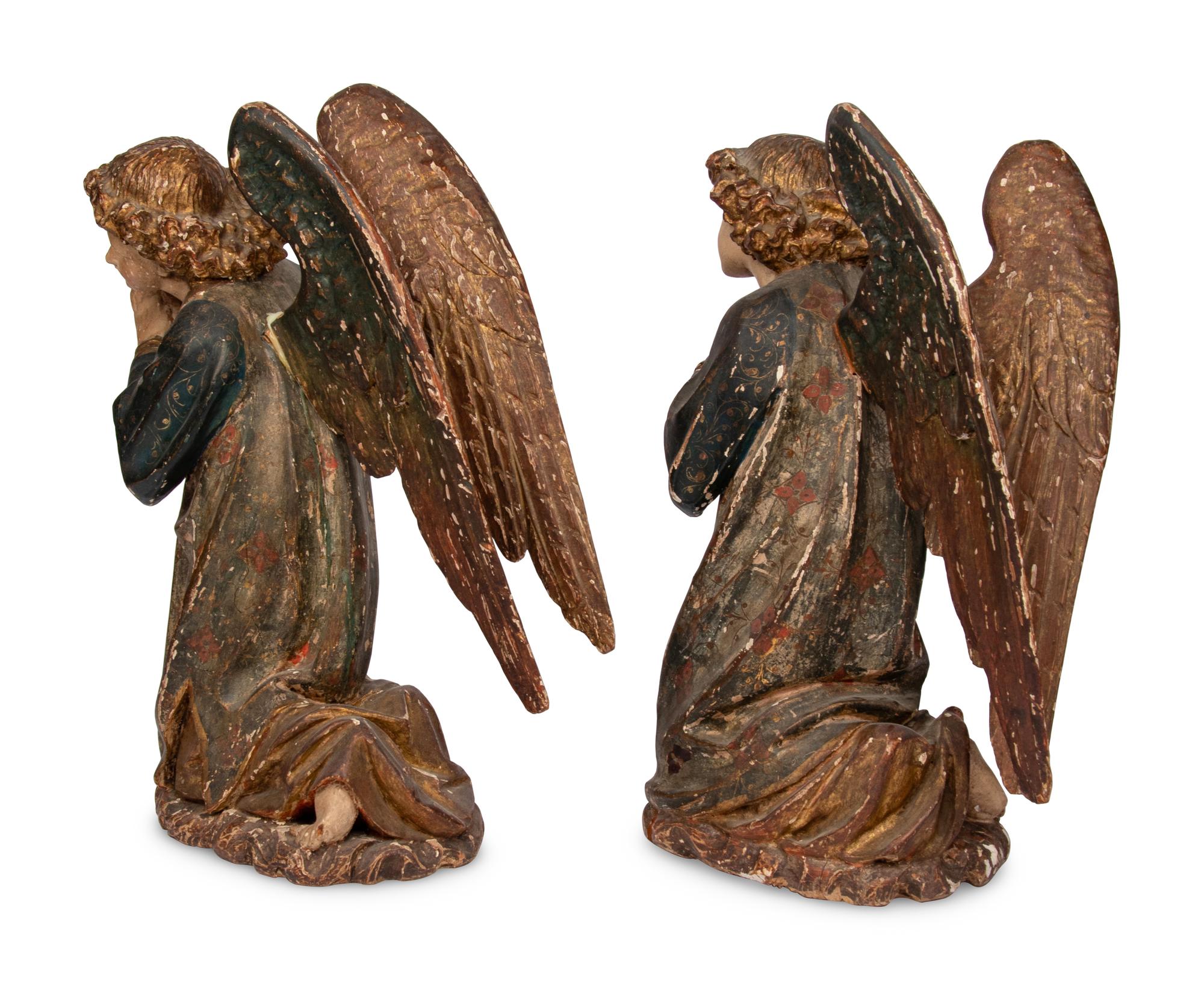 A Pair of Carved and Polychrome Decorated Figures of Kneeling Angels