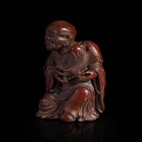 A Chinese finely-carved bamboo luohan and lion 竹雕笑狮罗汉 Qing dynasty ?