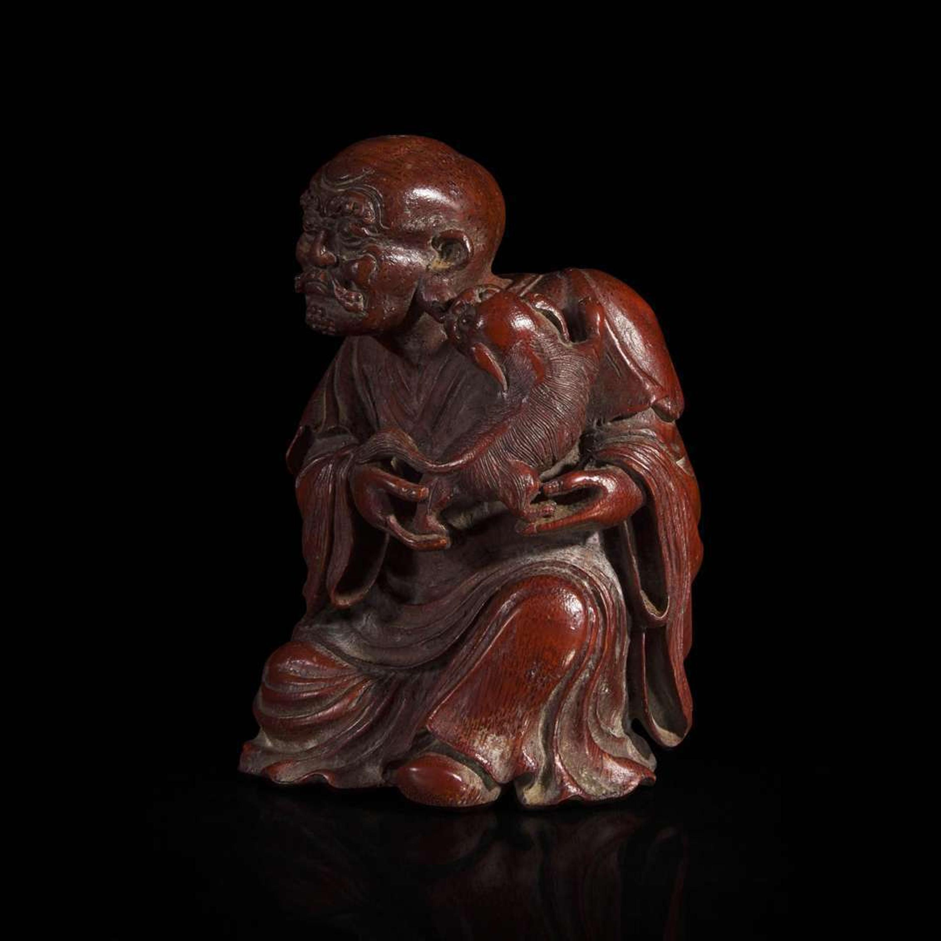A Chinese finely-carved bamboo luohan and lion 竹雕笑狮罗汉 Qing dynasty ?