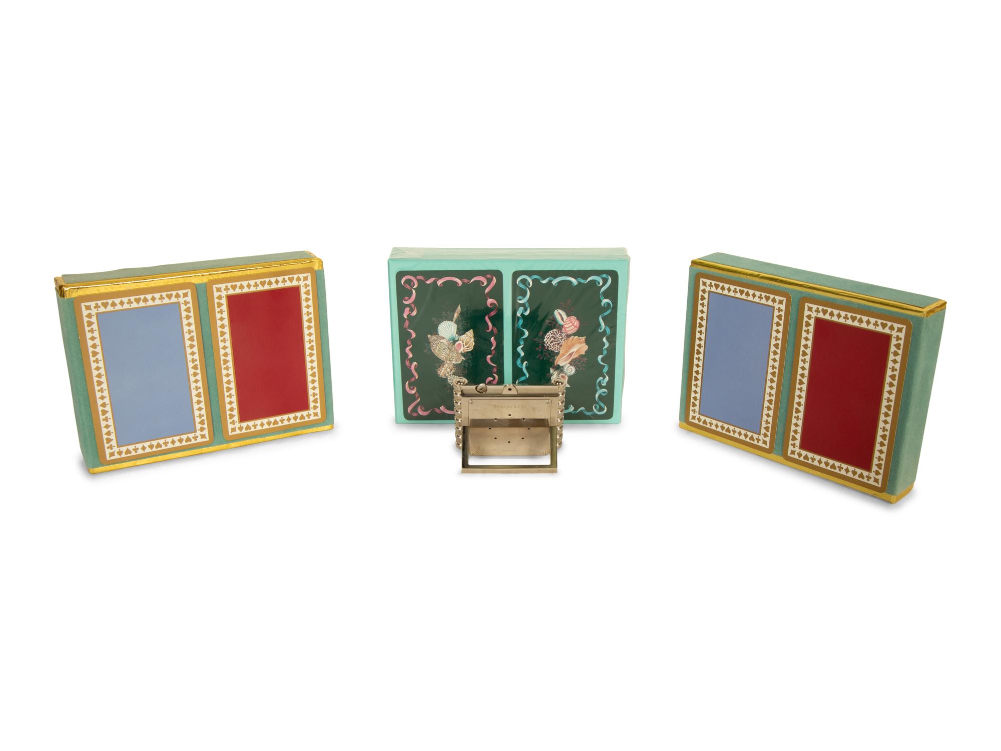 A Tiffany and Co. Travel Clock and Three Sets of Playing Cards