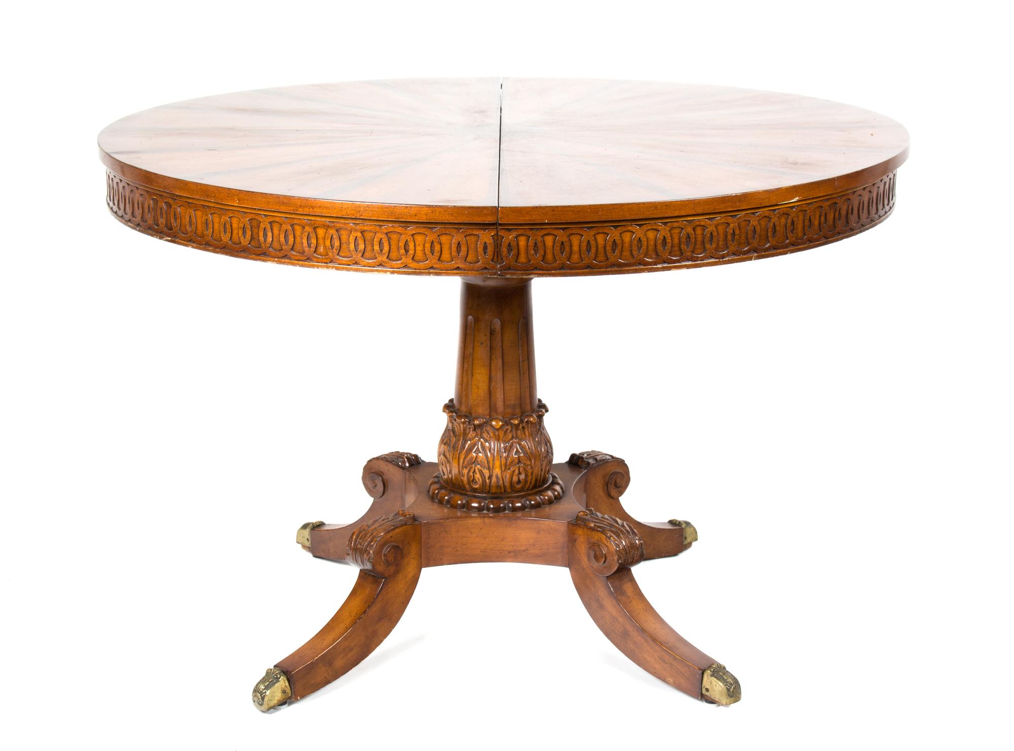 A Continental Inlaid Walnut Table Diameter 44 inches (closed); width of each leaf 23 7/8 inches. — 20TH CENTURY