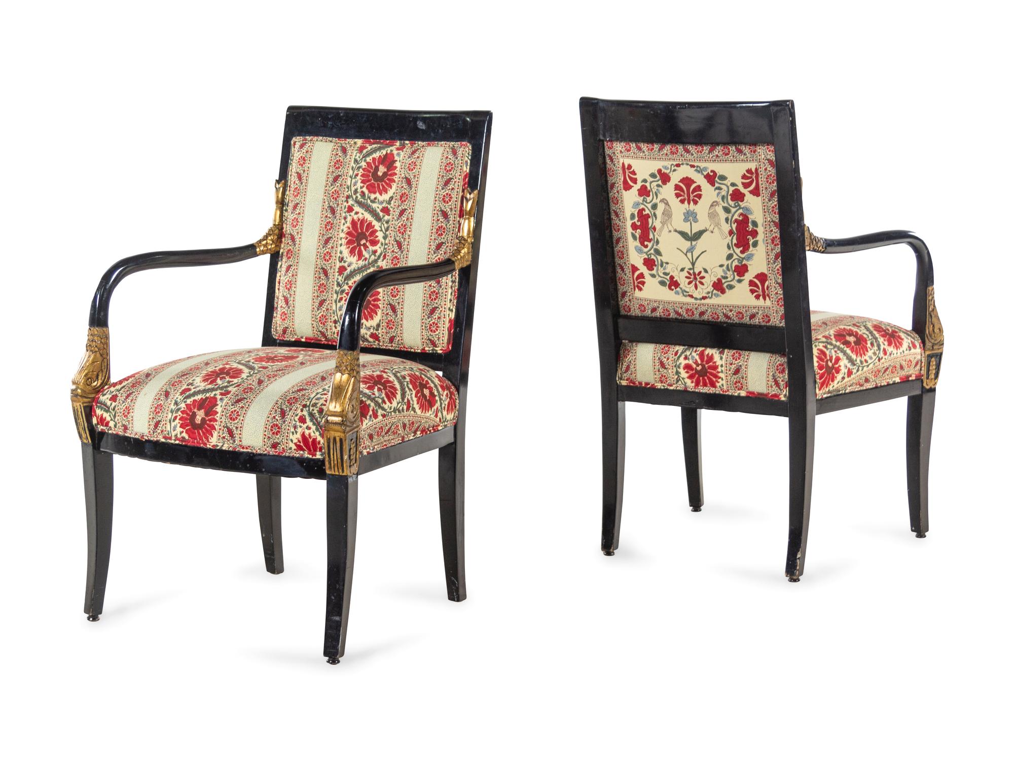 A Pair of Louis Philippe Style Parcel Gilt and Ebonized Armchairs