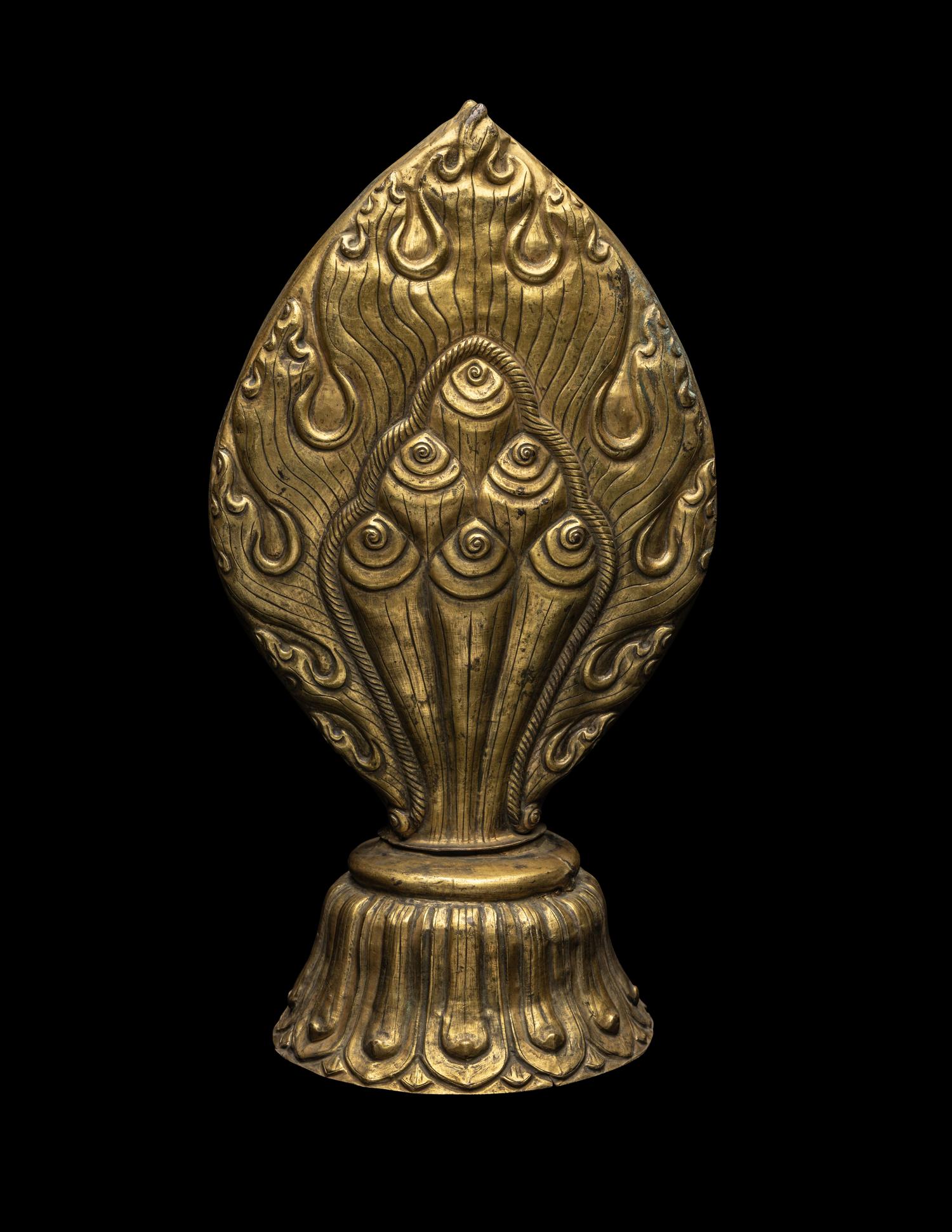 A Nepalese Repoussé Gilt Bronze Flaming Jewel Altar Piece