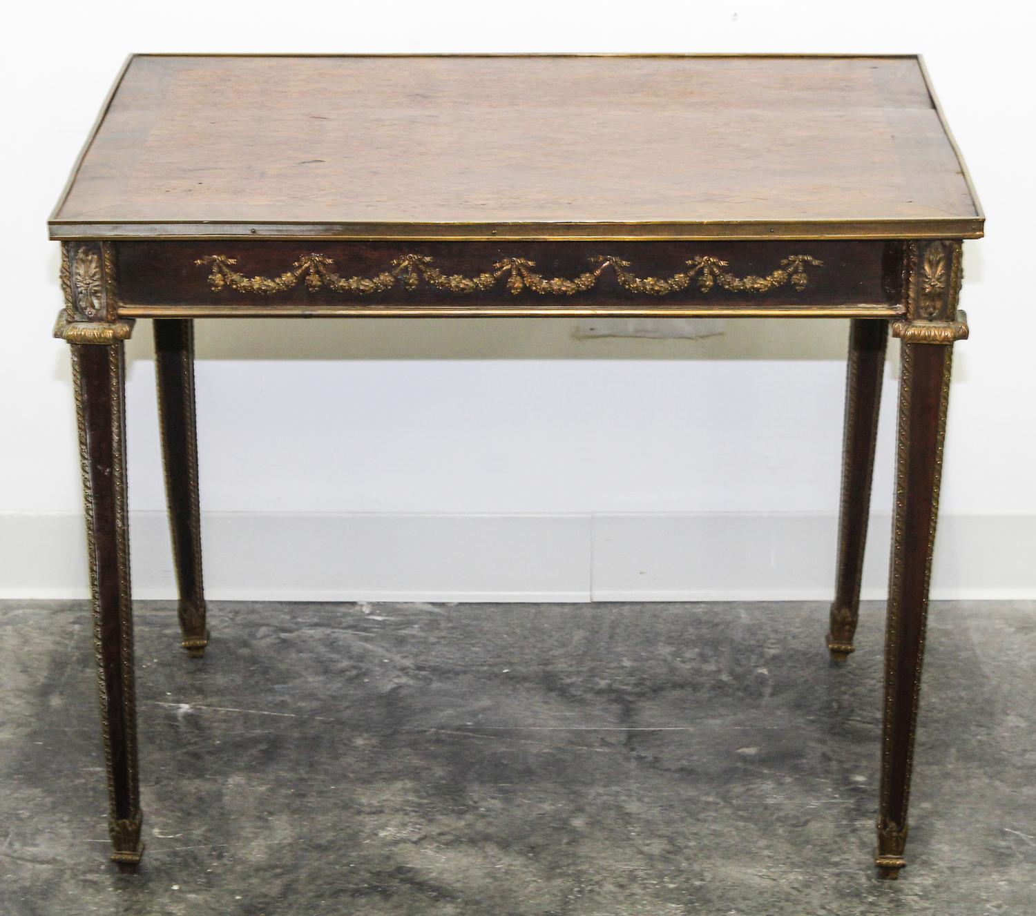 A Neoclassical Gilt Bronze Mounted Parquetry Side Table Height 25 1/2 x width 31 x depth 21 1/2 inches.