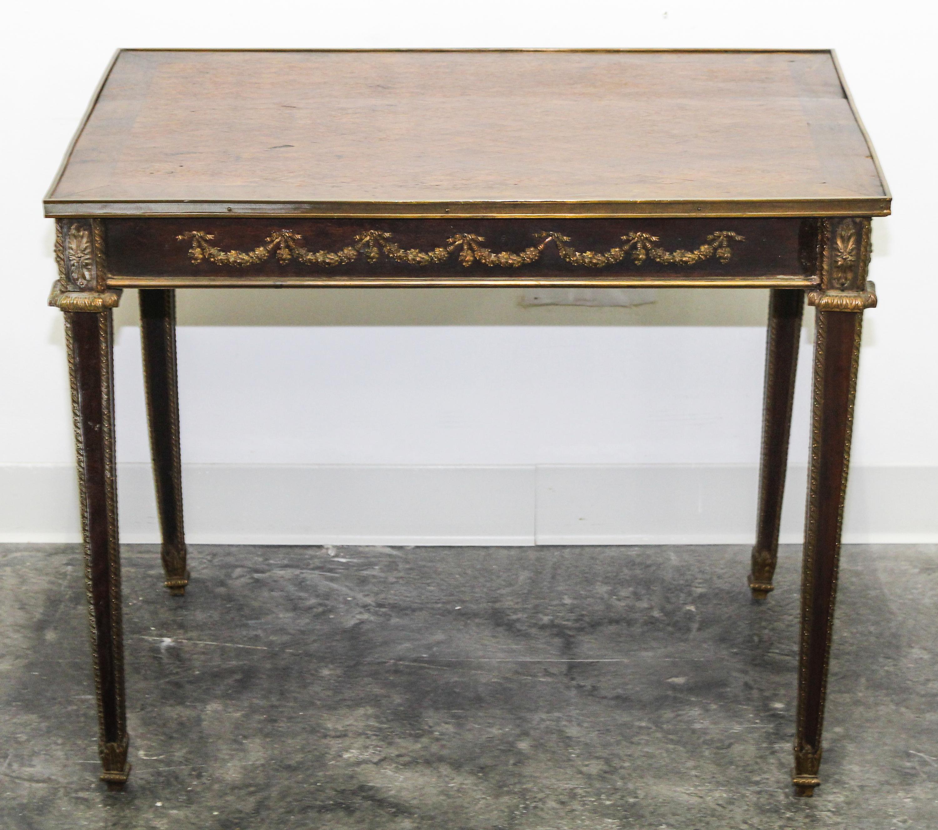 A Neoclassical Gilt Bronze Mounted Parquetry Side Table Height 25 1/2 x width 31 x depth 21 1/2 inches.