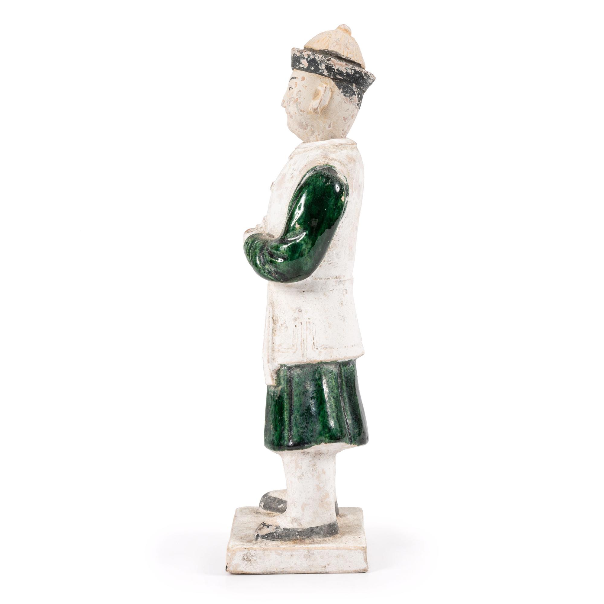 A Chinese Terracotta Figure with Polychrome Decoration