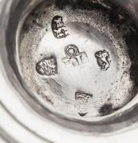 A George III Silver Twin-Handled Cup, John Langlands I, Newcastle, 1772, of baluster form with an applied waist band, having twin S-scr