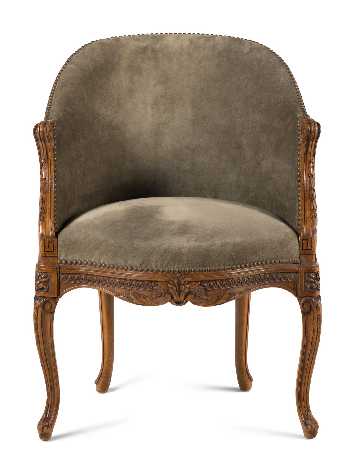 A Louis XVI Style Carved Beechwood and Caned Bergère