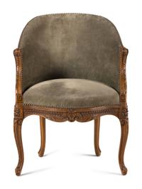 A Louis XVI Style Carved Beechwood and Caned Bergère