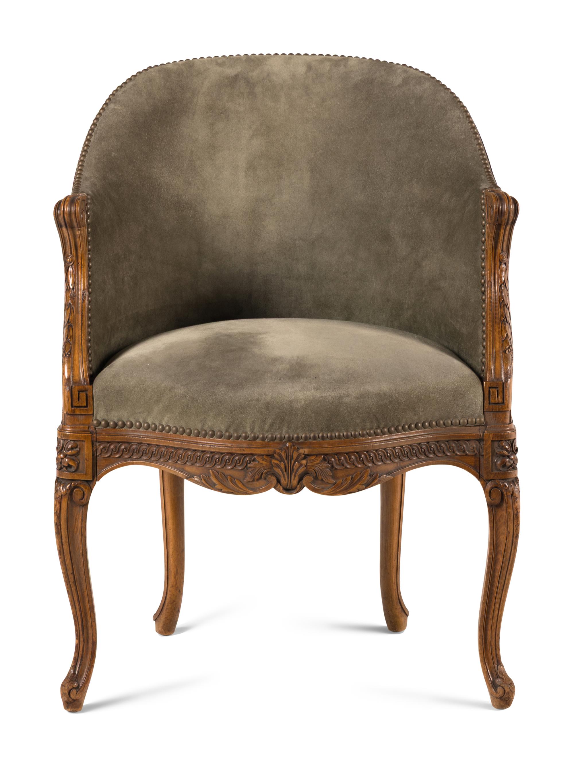 A Louis XVI Style Carved Beechwood and Caned Bergère